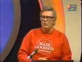 Charles Nelson Reilly wearing the logo on his sweatshirt